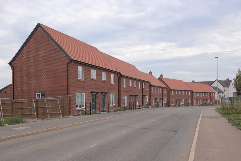 New red brick terraced houses along a street at Fairham in Nottingham